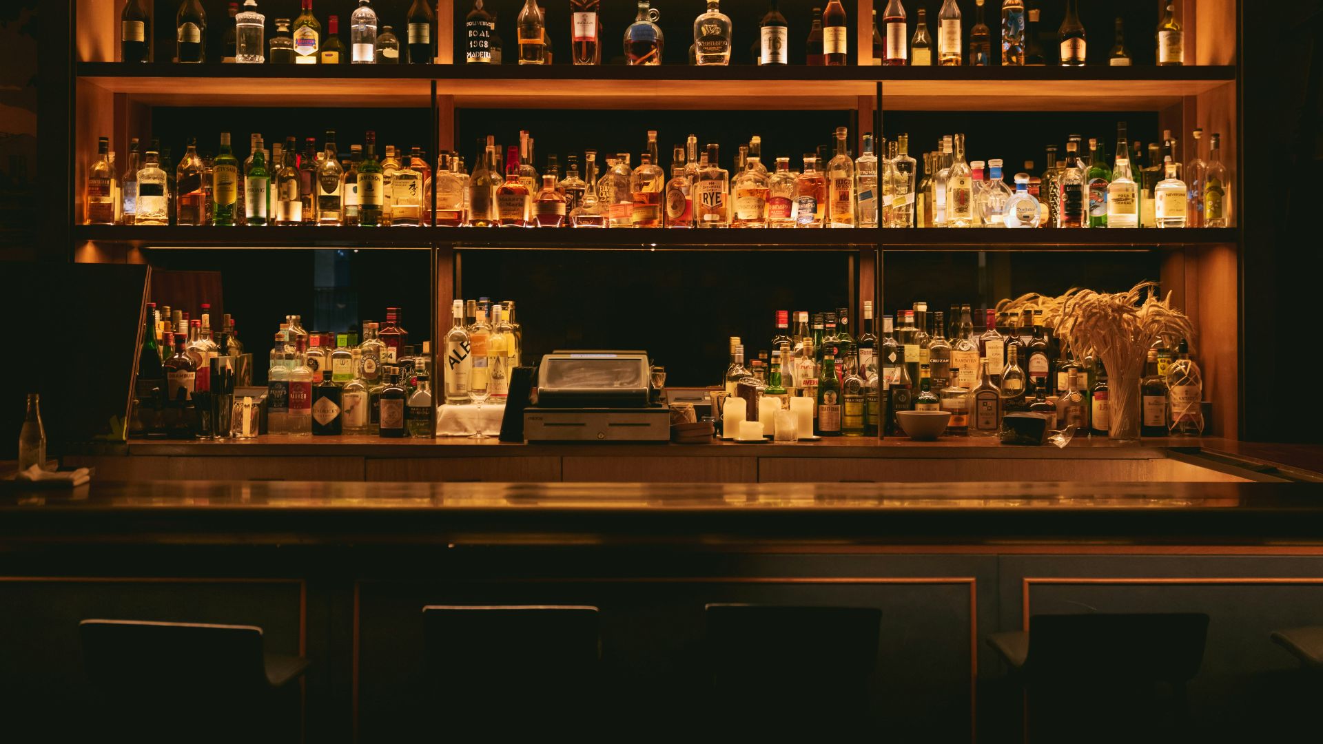 brown wooden shelf with bottles