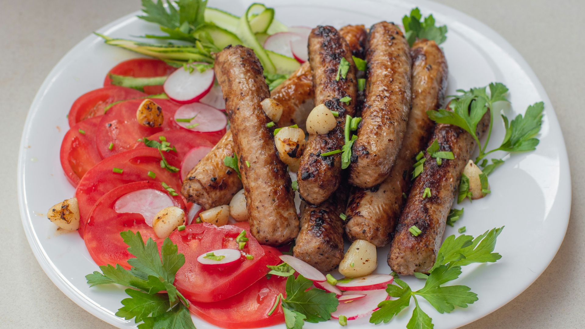 a white plate topped with meat and veggies