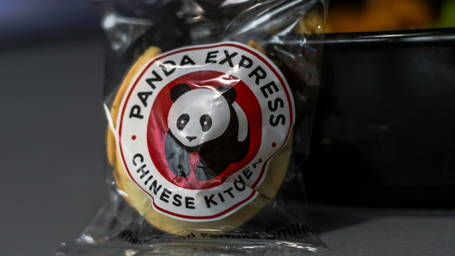 A bag of panda express chinese kits sitting on a table