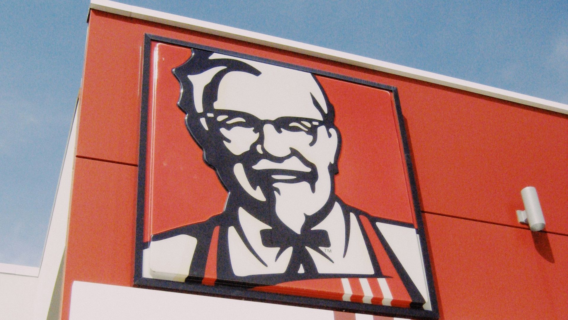 a picture of a man on the side of a building