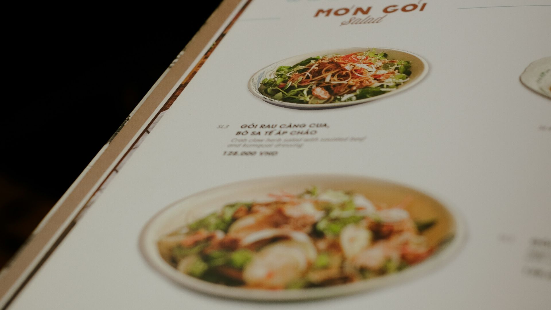 a menu is open on a wooden table