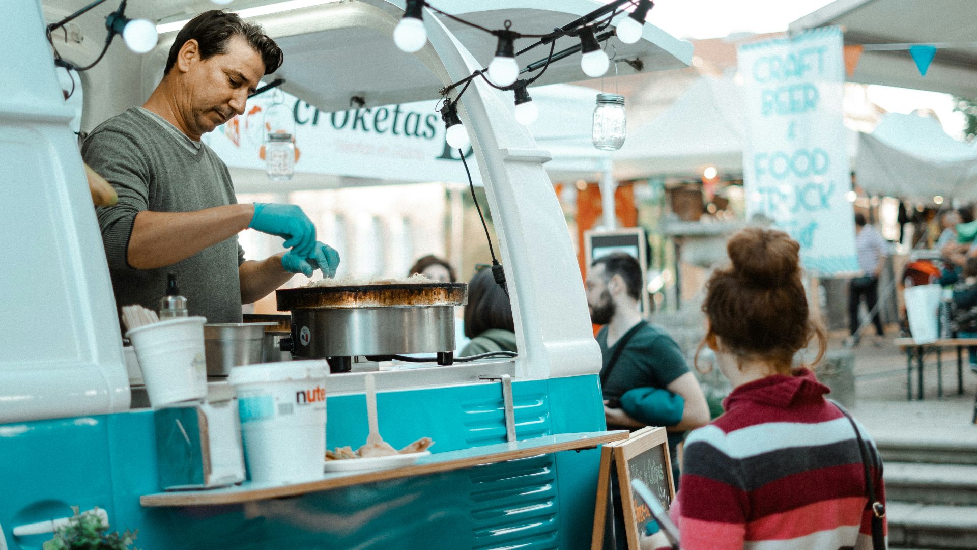 woman wears multicolored striped sweater