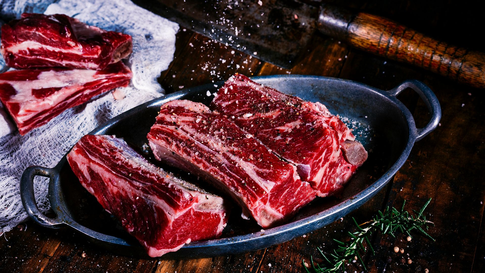 sliced meat on black wooden table