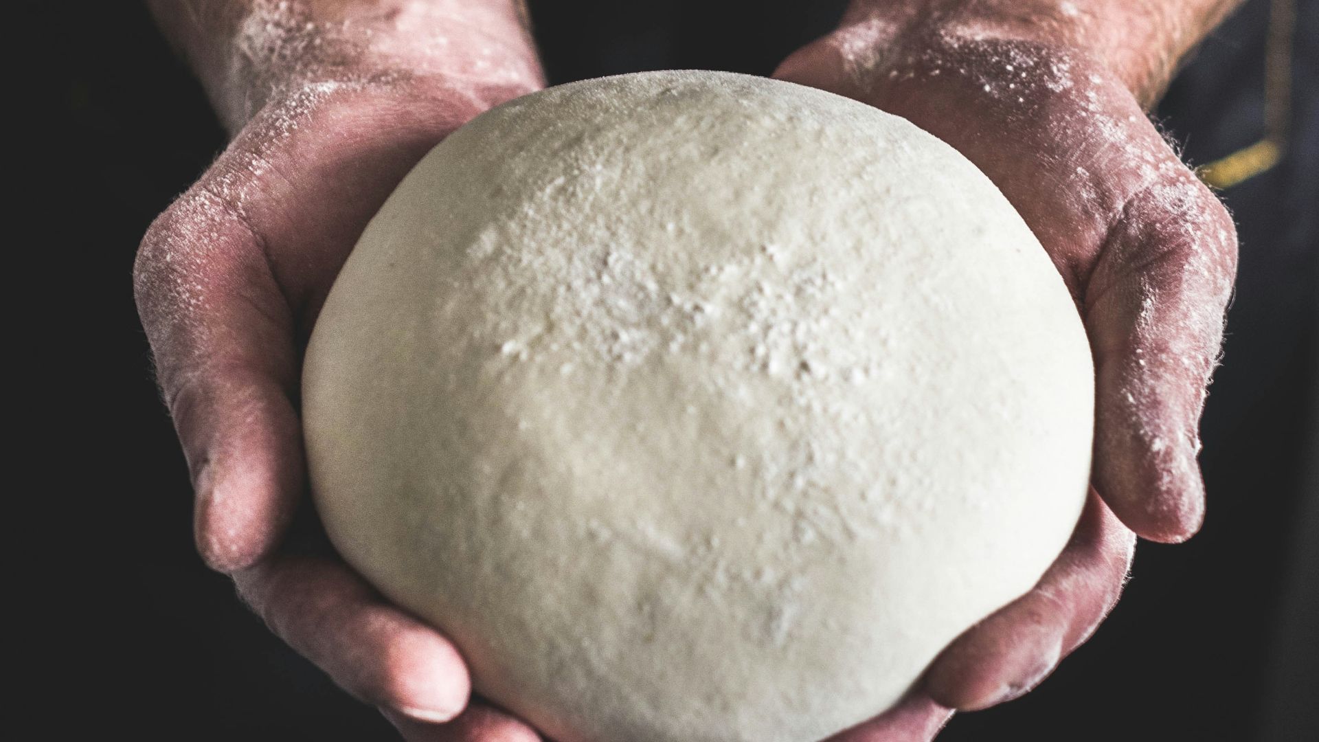 person holding dough