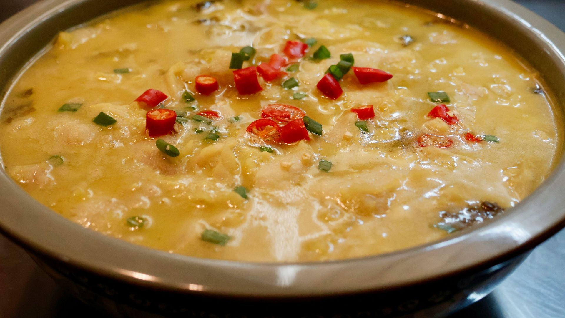 a bowl of soup is sitting on a table
