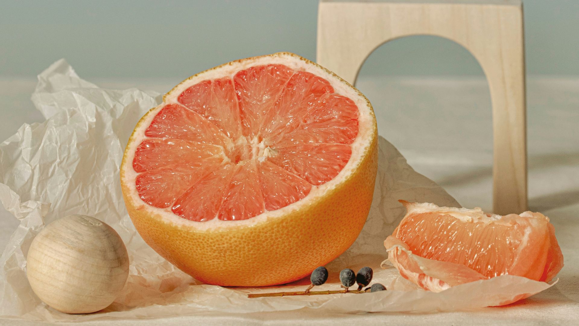 a grapefruit cut in half sitting on a table