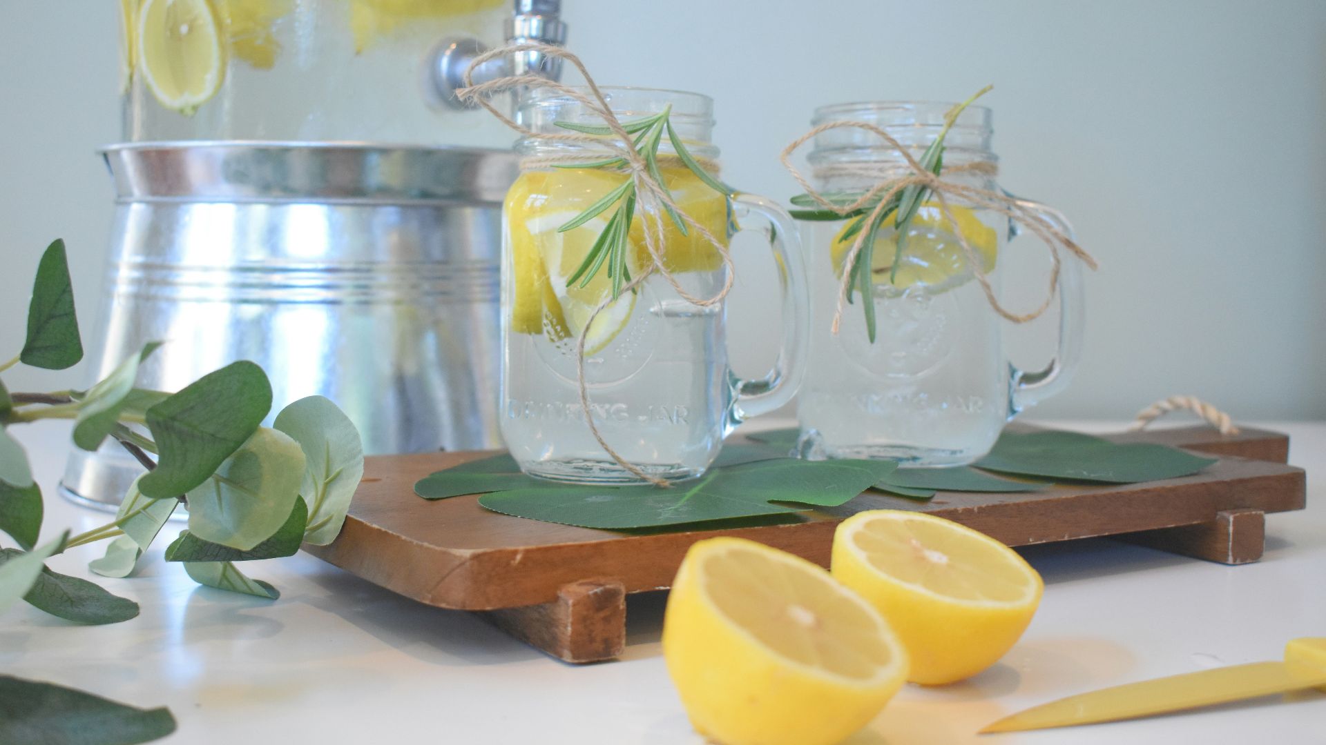 a couple of lemons sitting on top of a cutting board