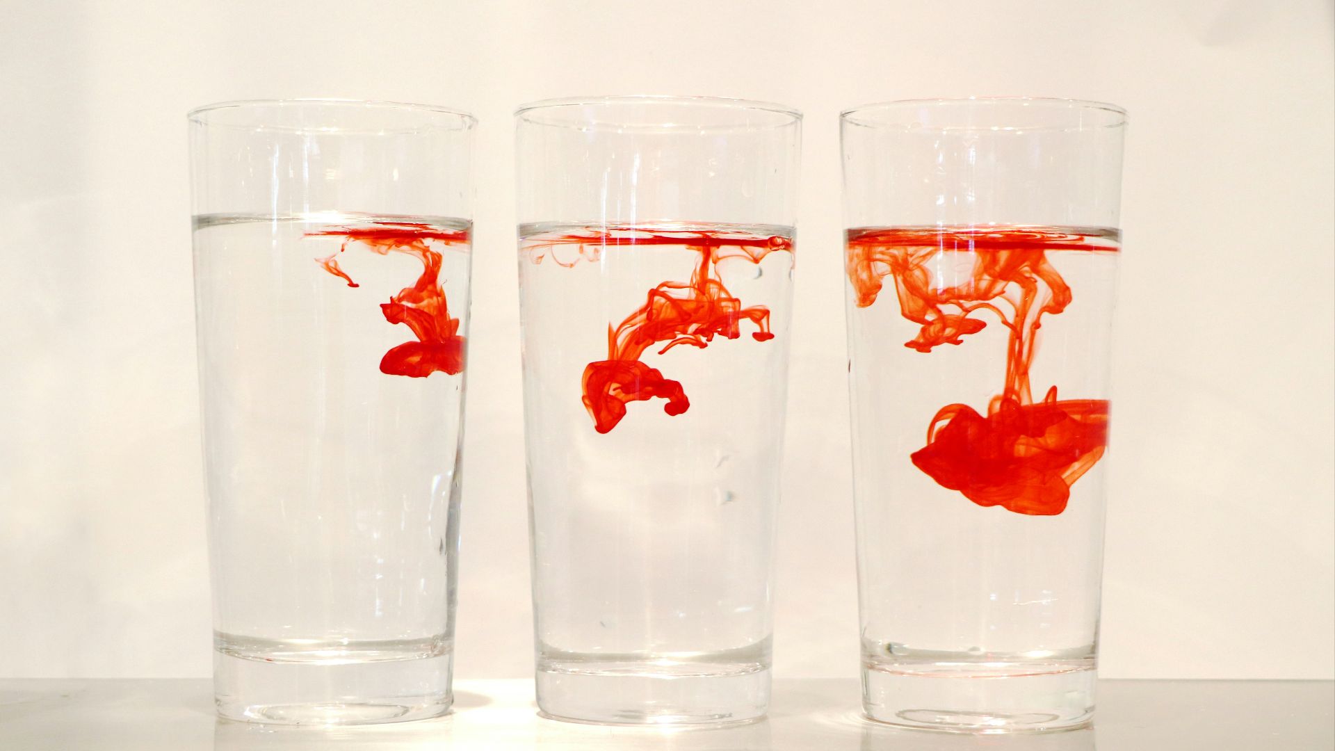 red powder in three clear drinking glasses