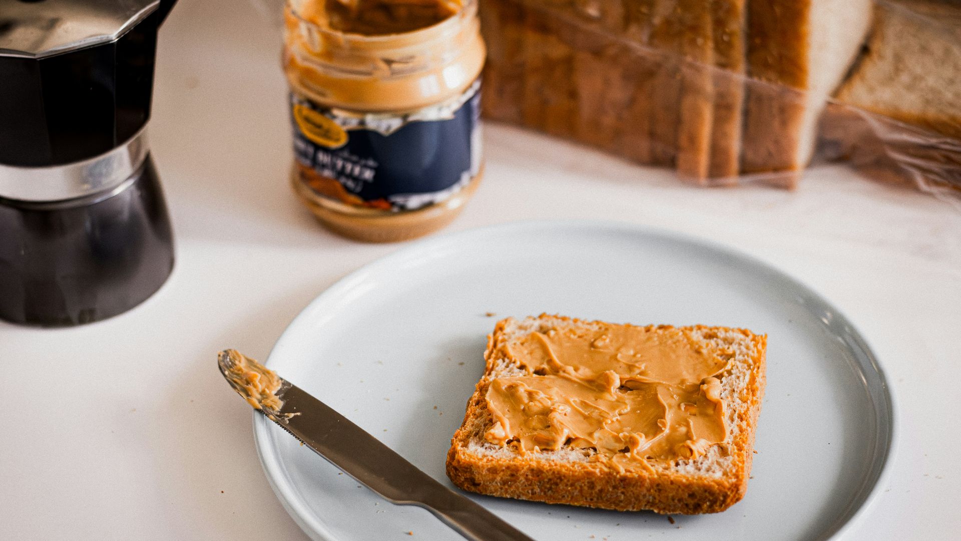 a piece of bread sitting on top of a white plate