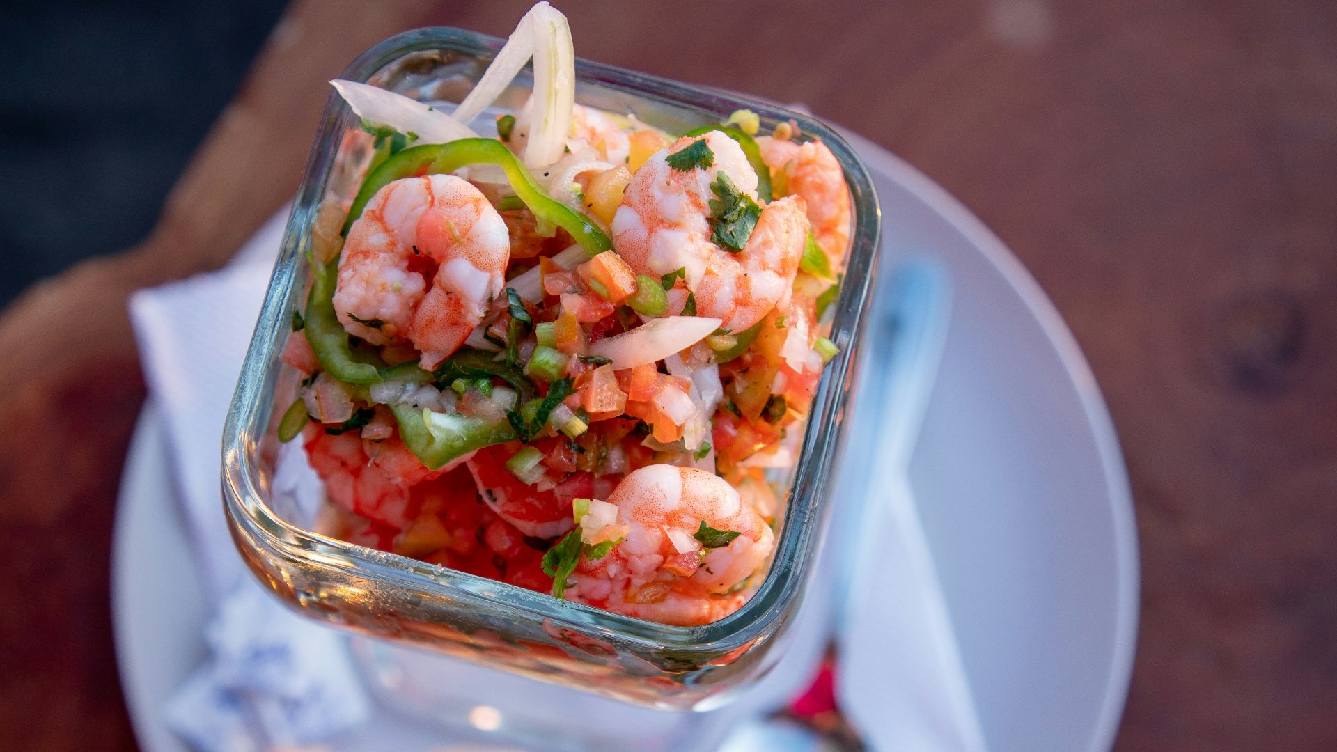 sliced vegetables in clear glass container