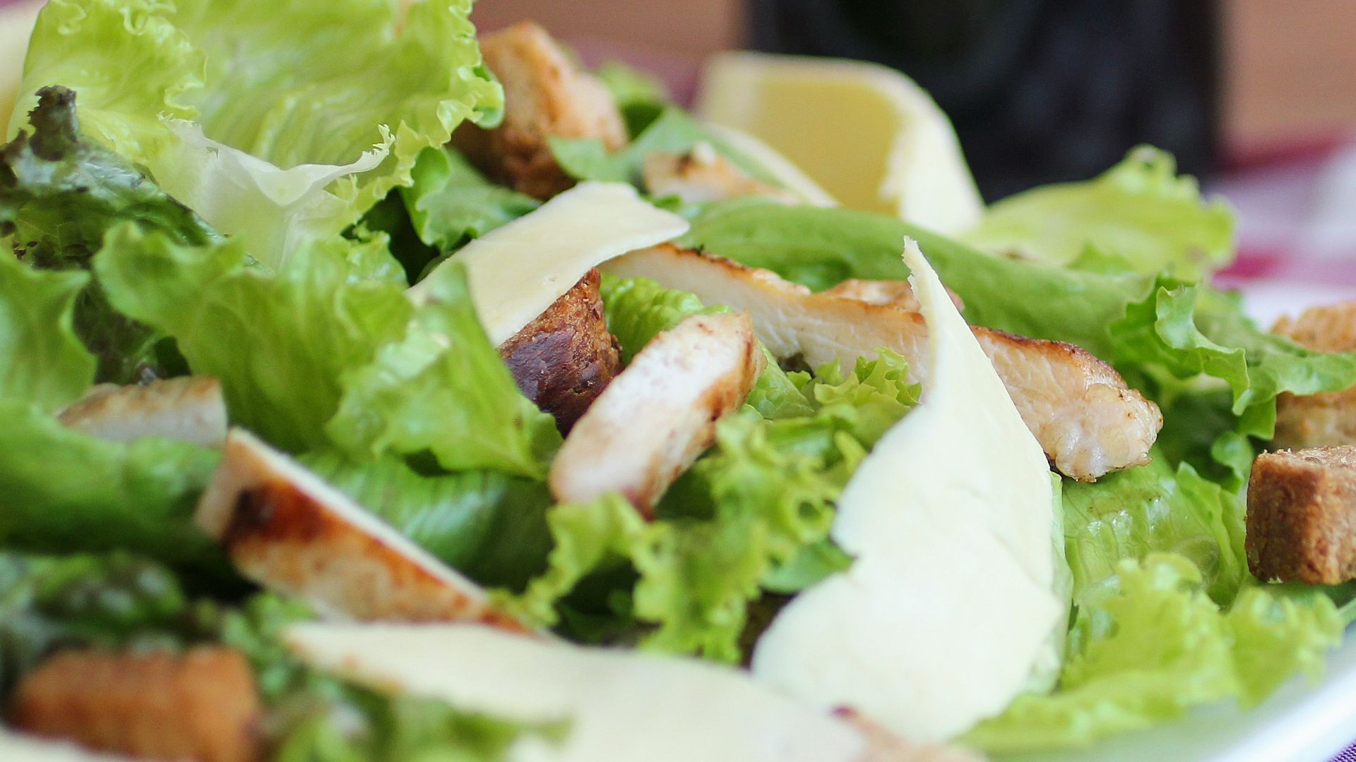 meat with lettuce on white ceramic plate