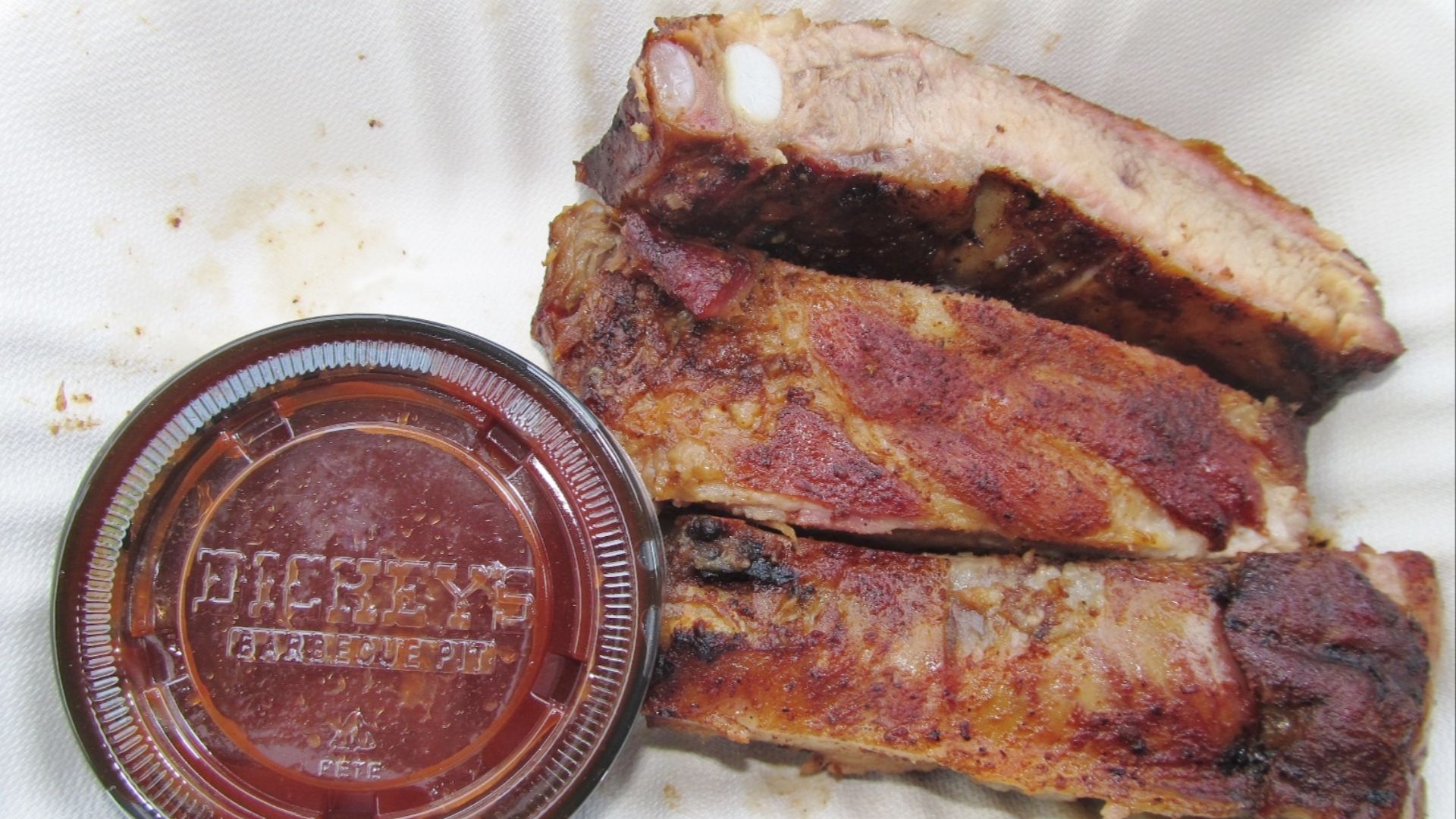 File:Dickey's Barbecue Pit BBQ Ribs and sauce (26992922061).jpg
