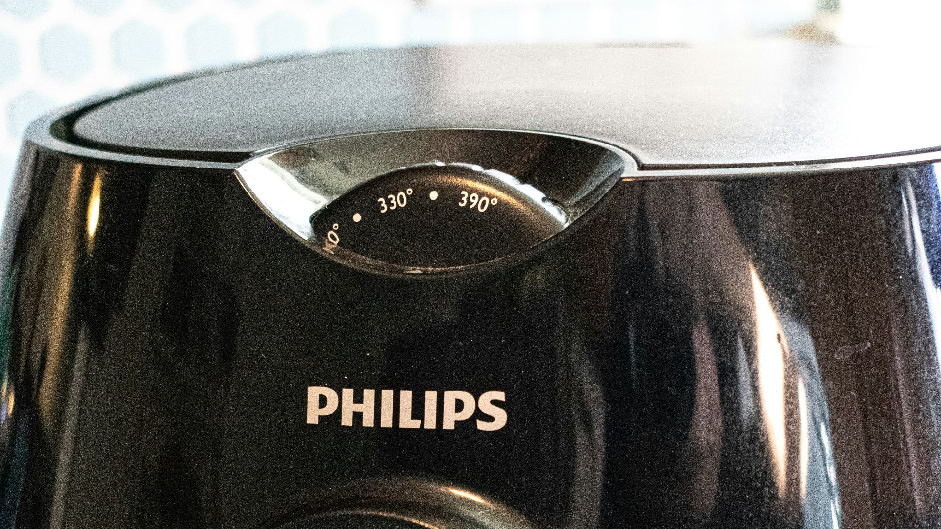a close up of a black blender on a table