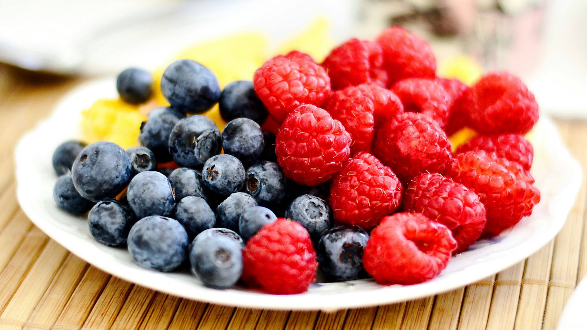 strawberries and blue berries on palte