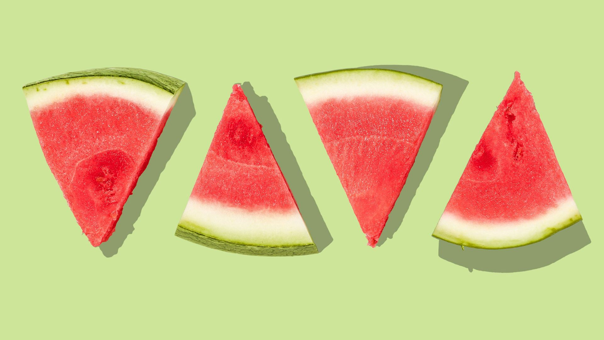 sliced watermelon with green background