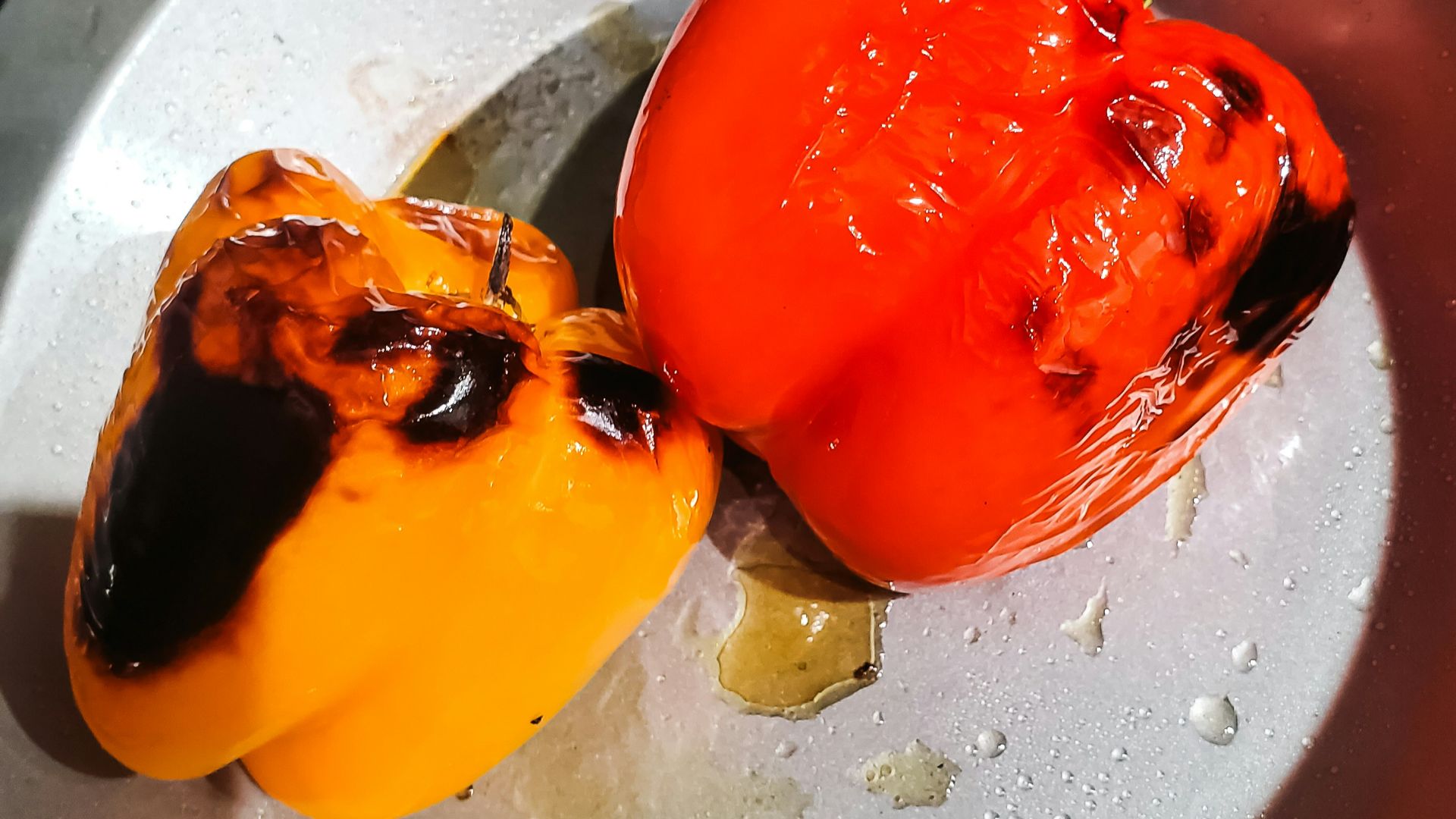 Roasted bell peppers in a pan.