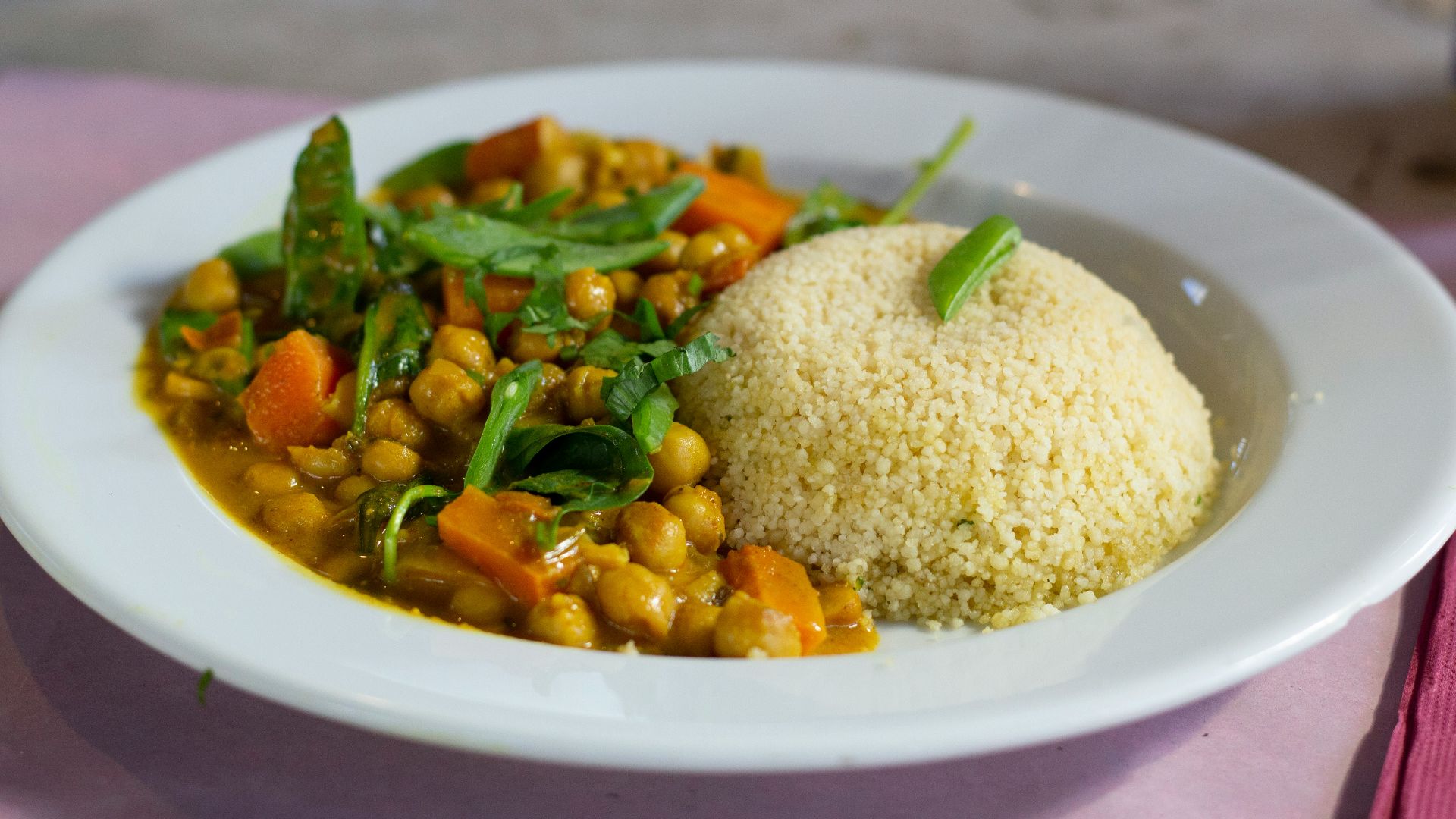 rice with green leaf vegetable on white ceramic plate