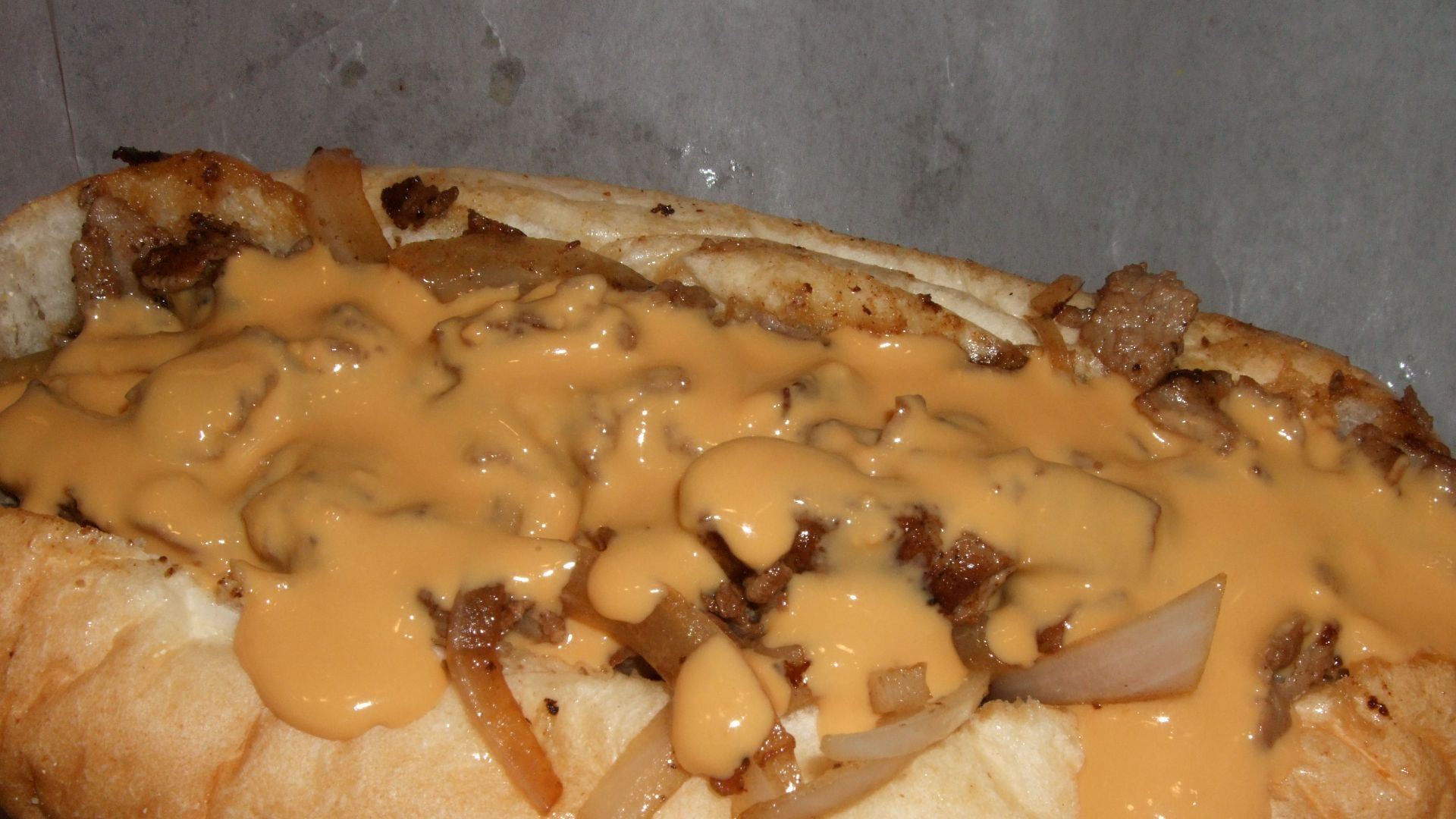 File:Cheesesteak sandwich with lots of cheese sauce.jpg