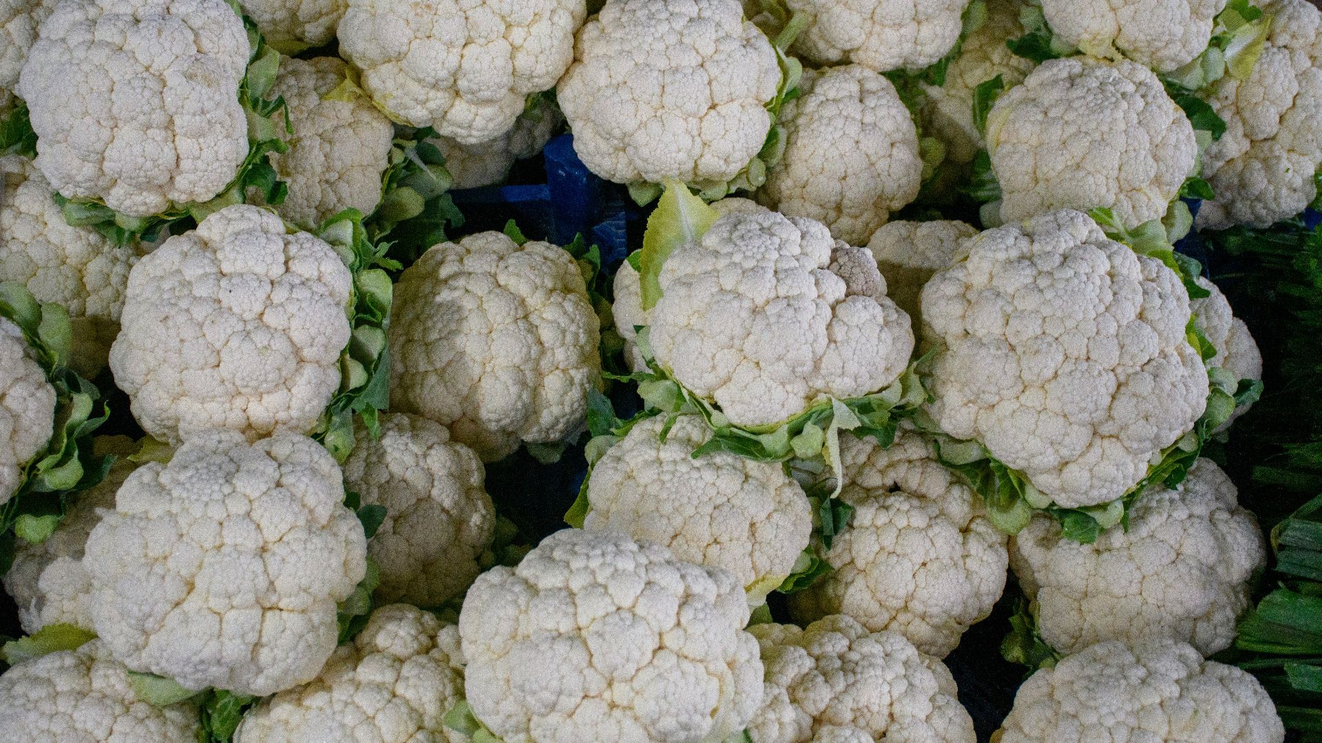 a bunch of cauliflower is piled on top of each other