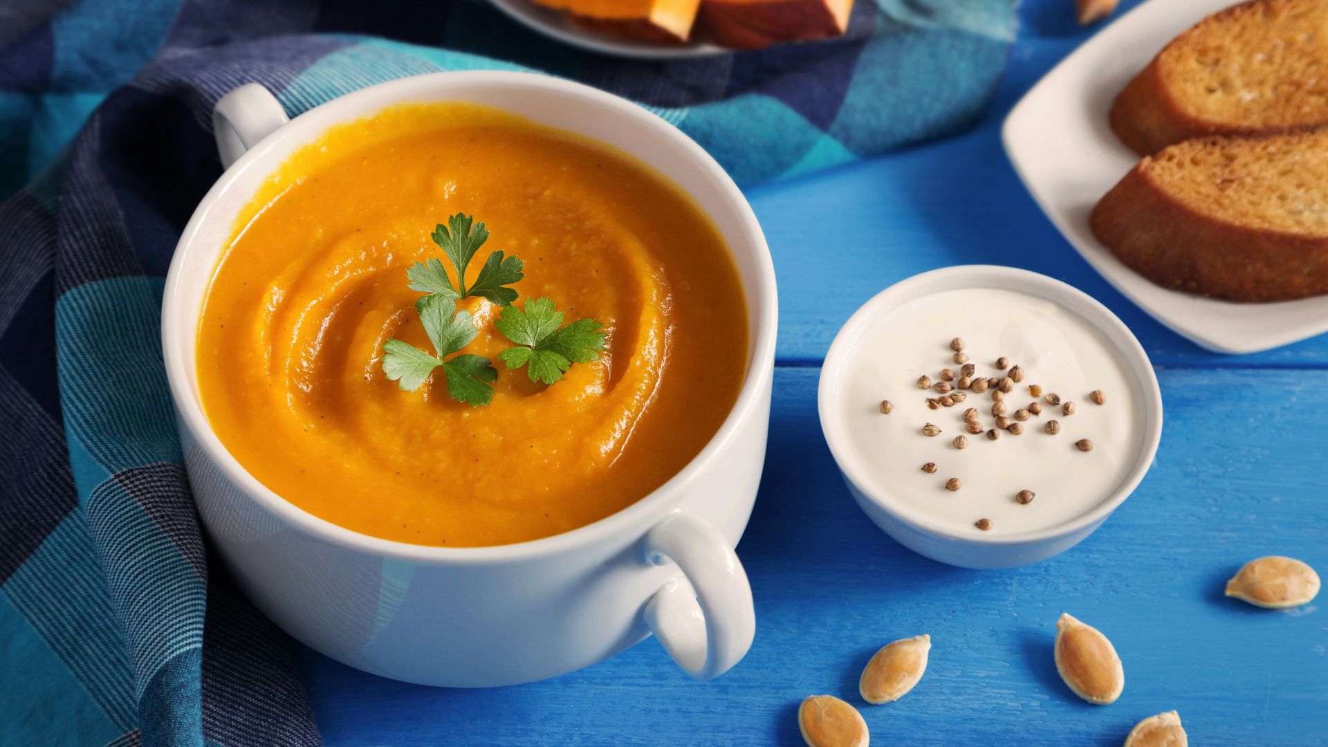 a cup of tea next to a plate of pastries