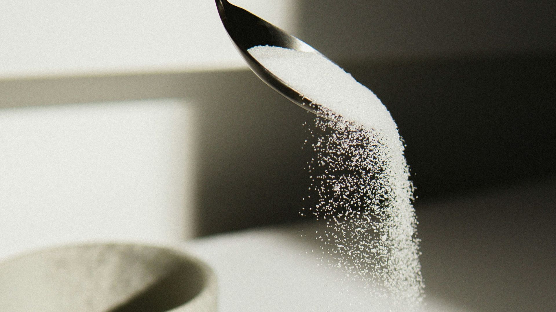 white ceramic bowl on white table