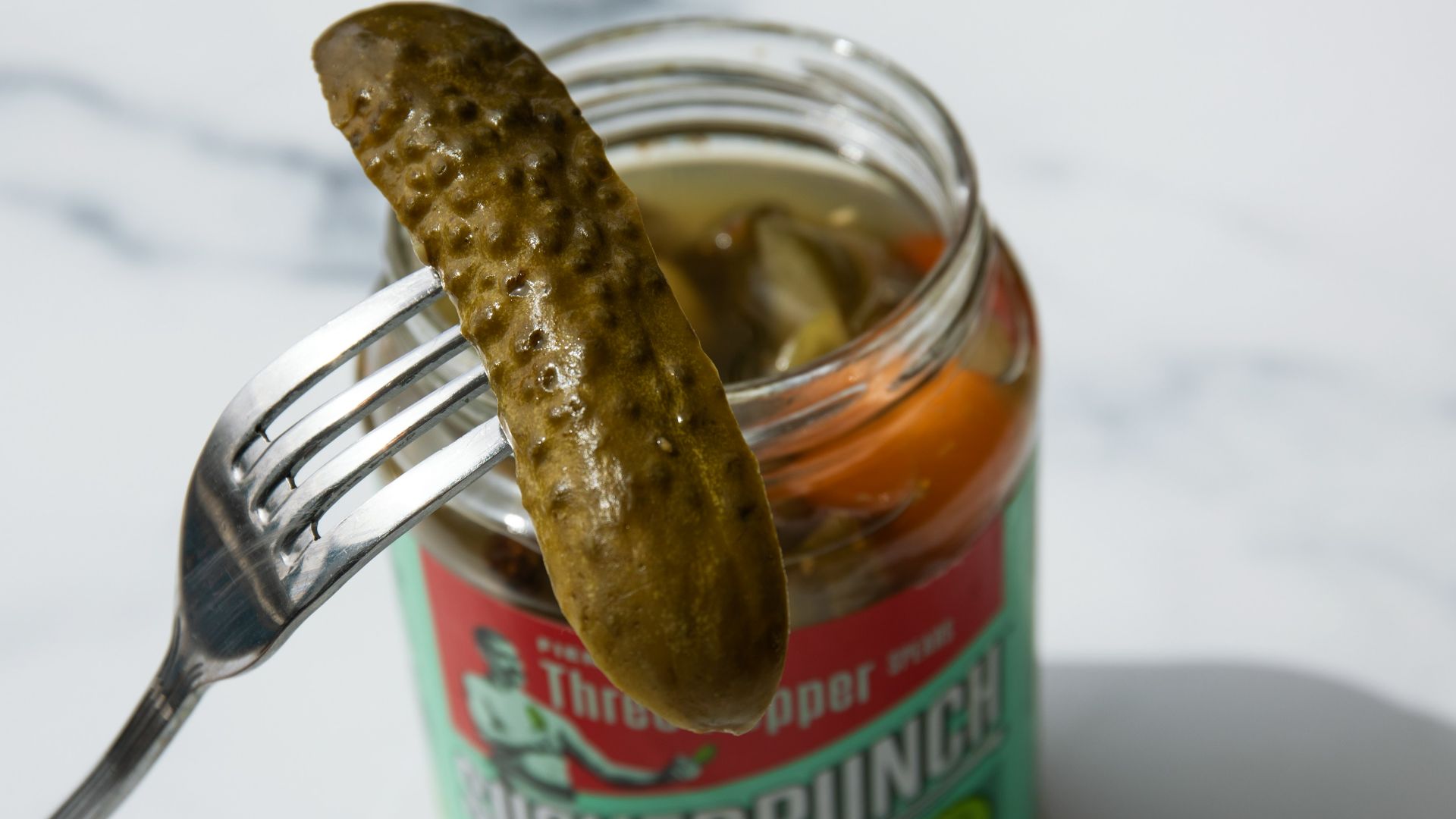 stainless steel fork on green labeled can