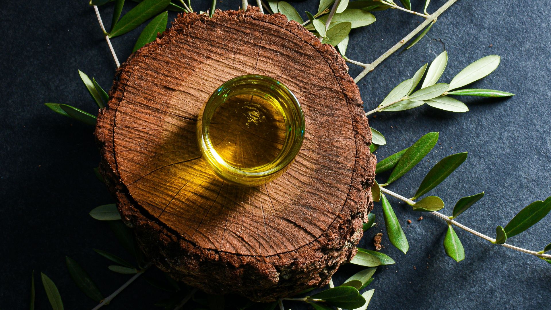 brown round wooden ornament on green leaves