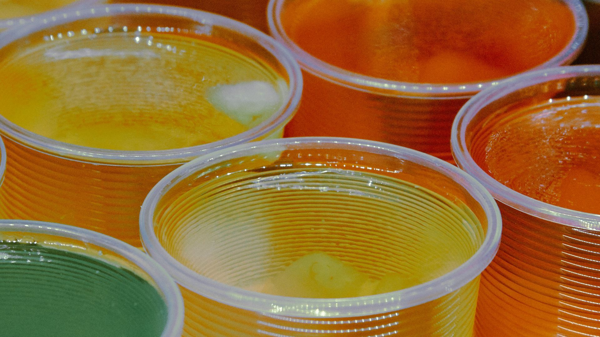 clear glass jars with yellow liquid