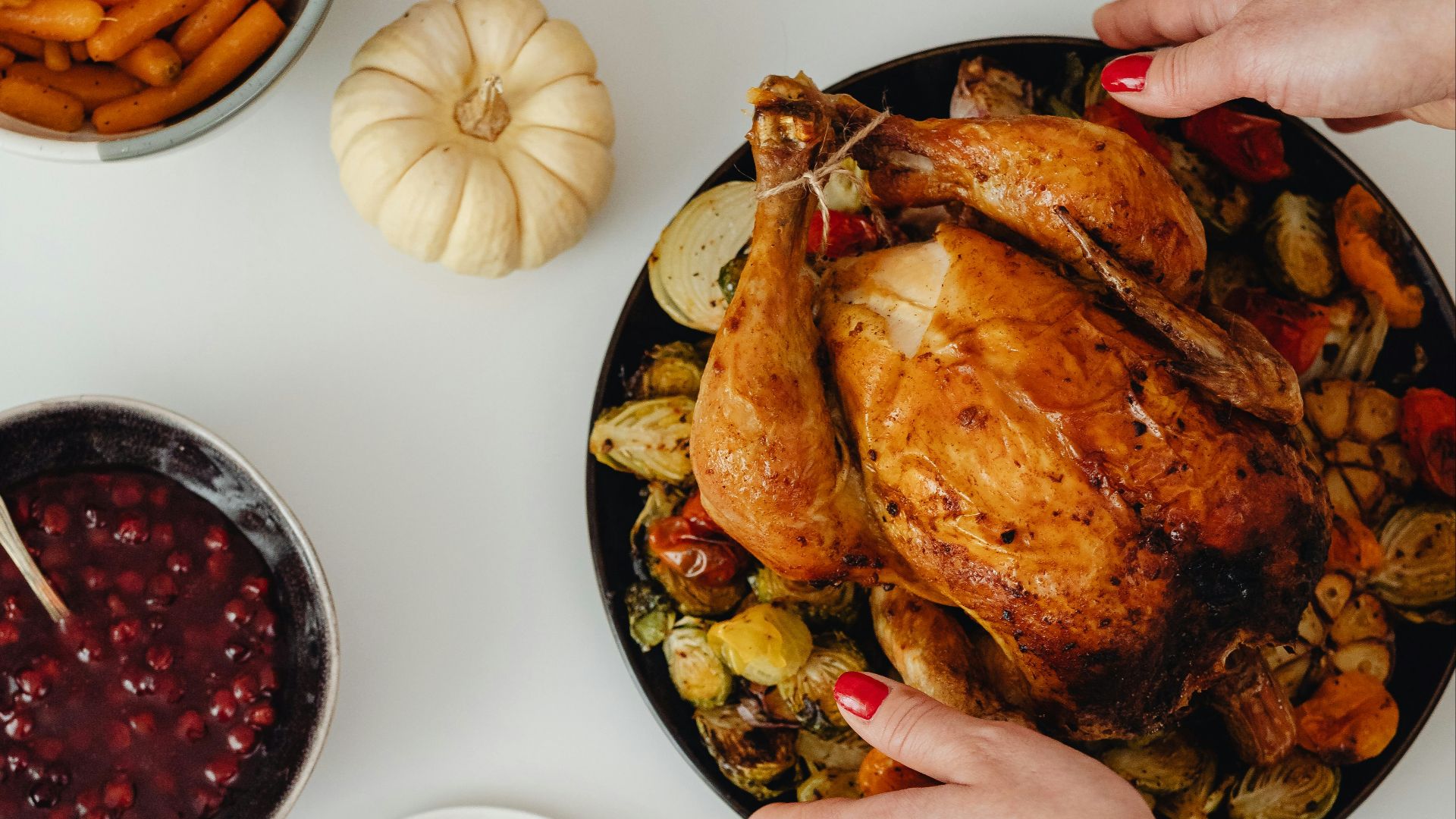 a person holding a plate of food
