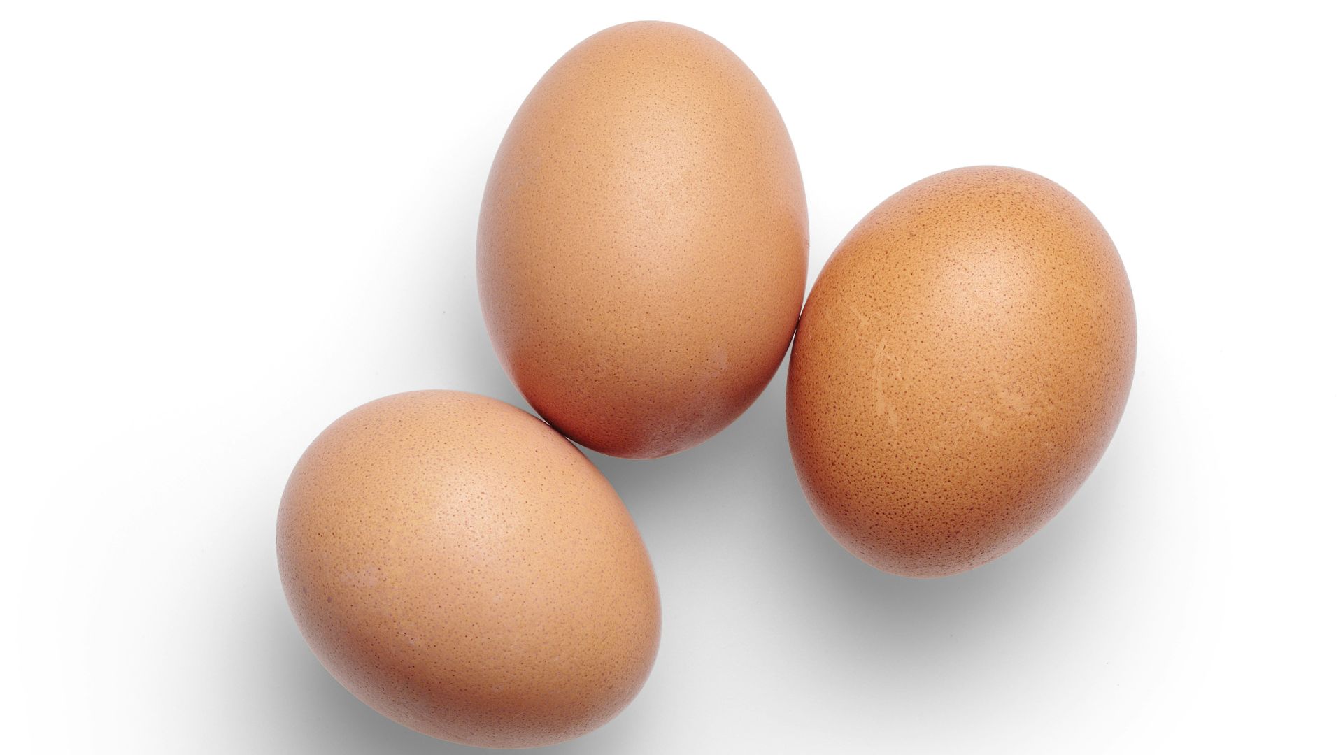 2 brown egg on white surface