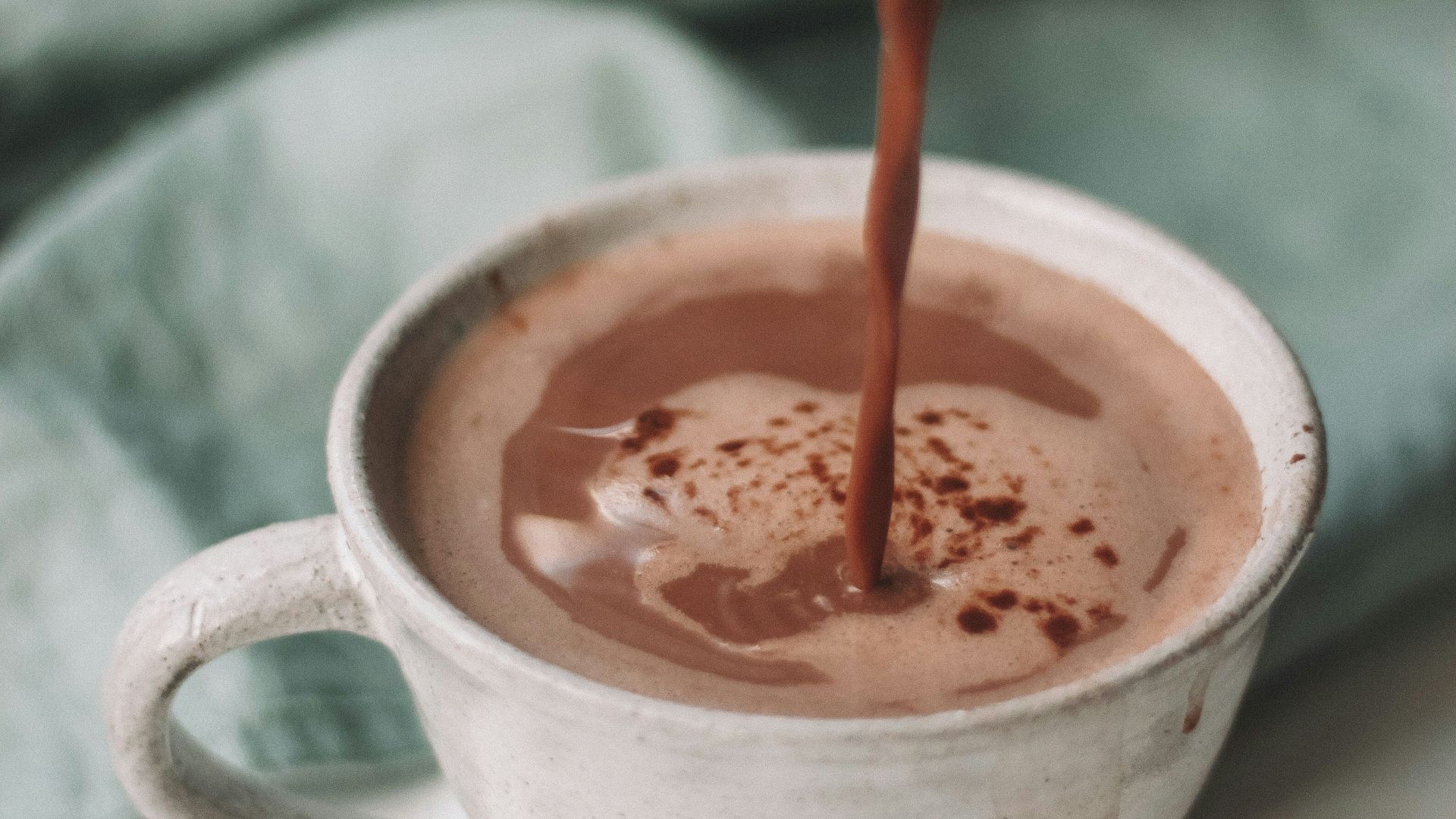 chocolate coffee pouring in white mug