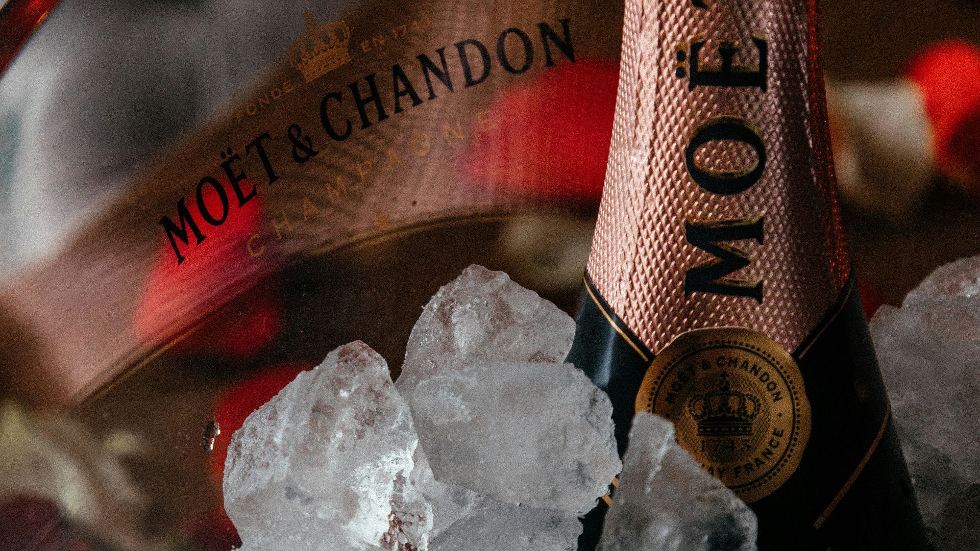 a bottle of champagne sitting on top of ice