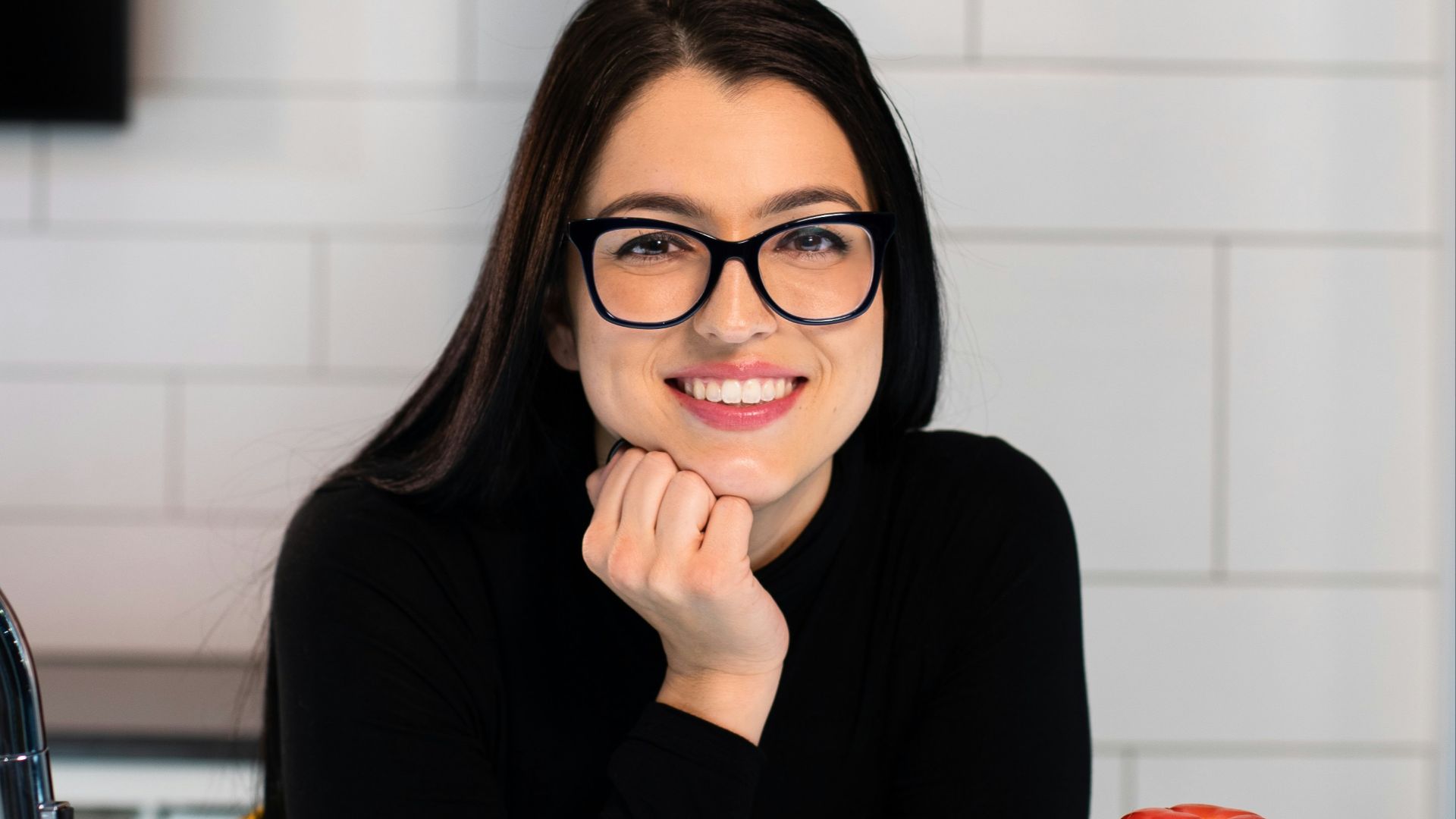 woman in black long sleeve shirt sitting on chair