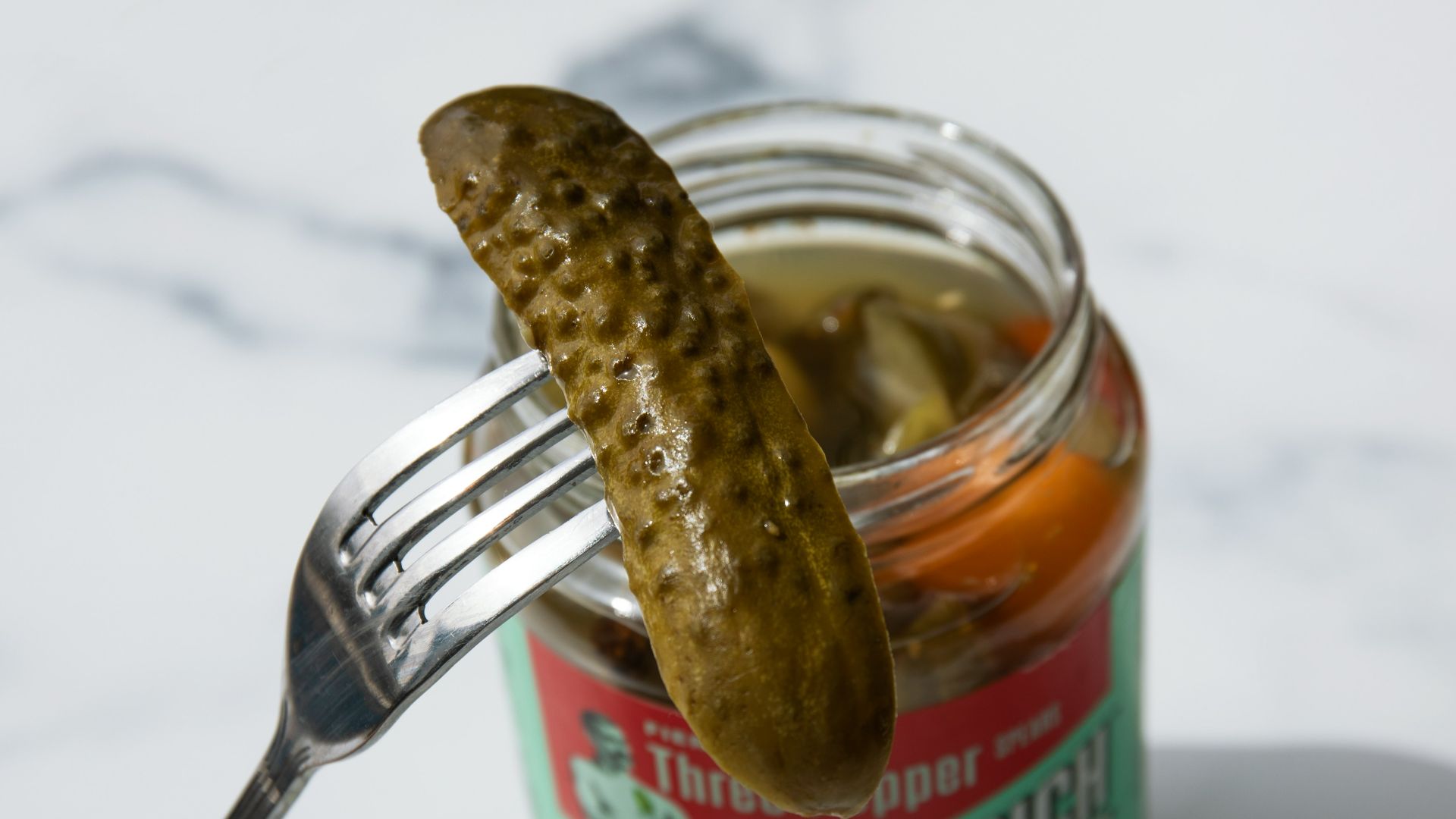 stainless steel fork on green labeled can