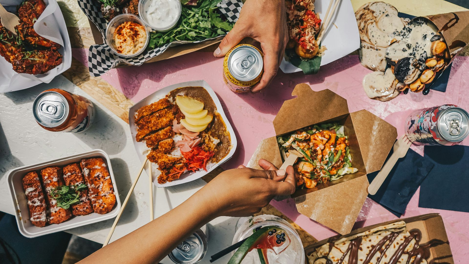 a group of people sitting around a table eating food
