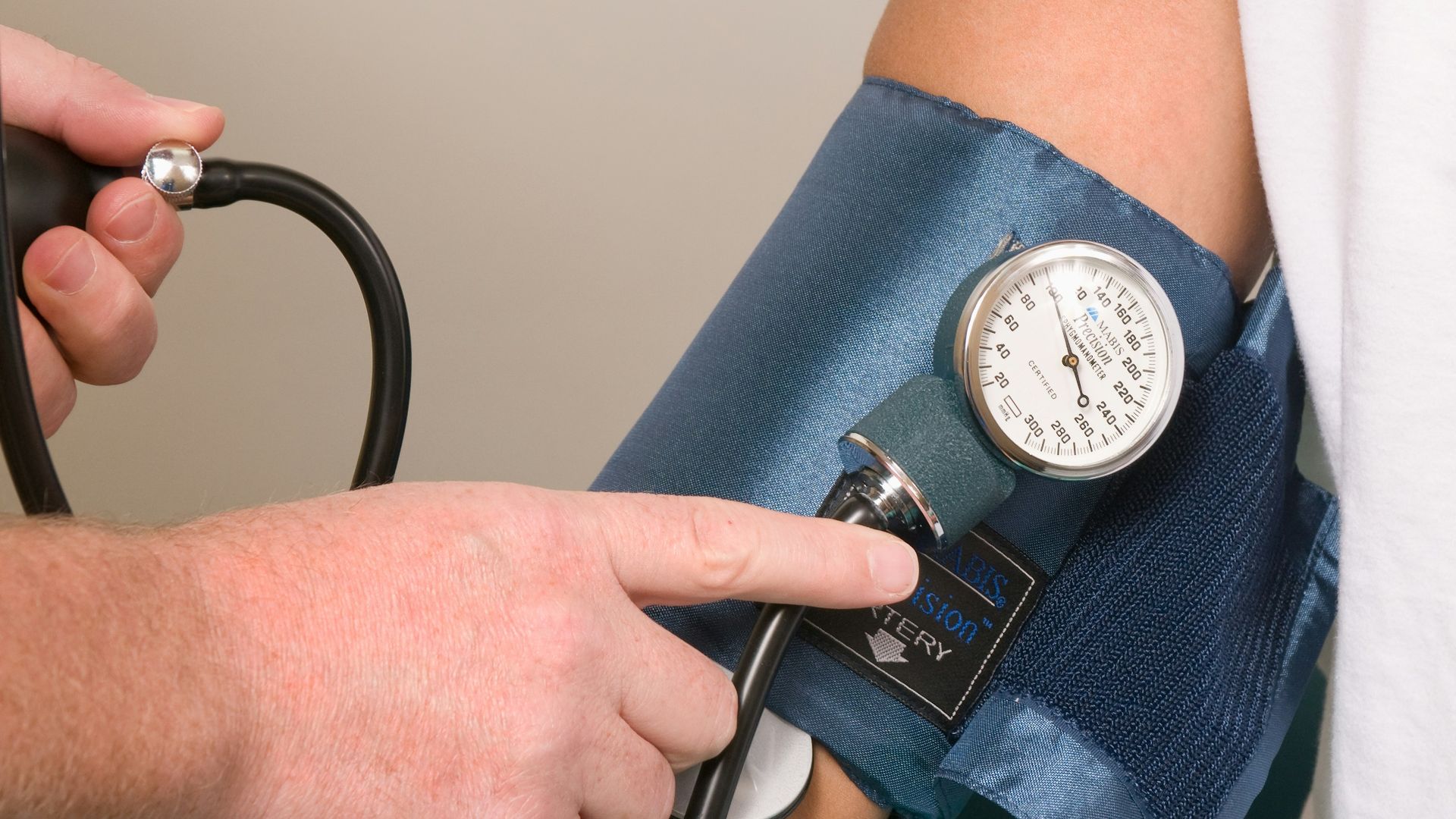 a doctor checking the blood pressure of a patient