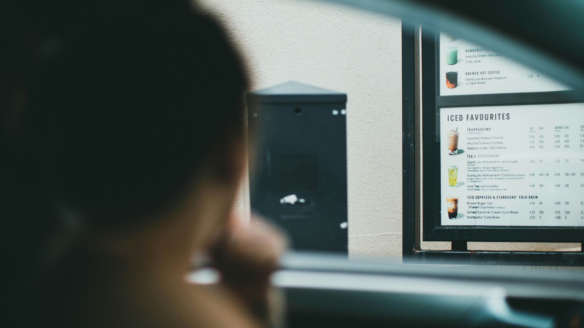 person holding black smartphone in car