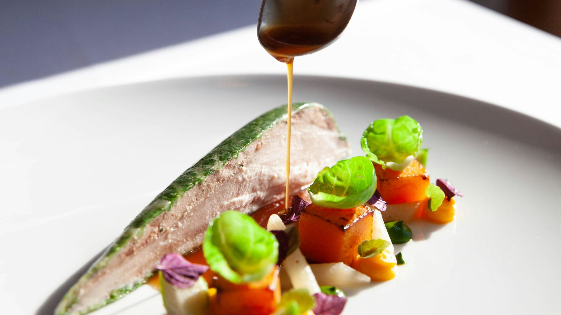 person holding stainless steel spoon