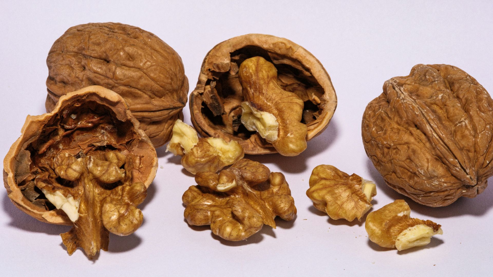 A group of walnuts sitting next to each other