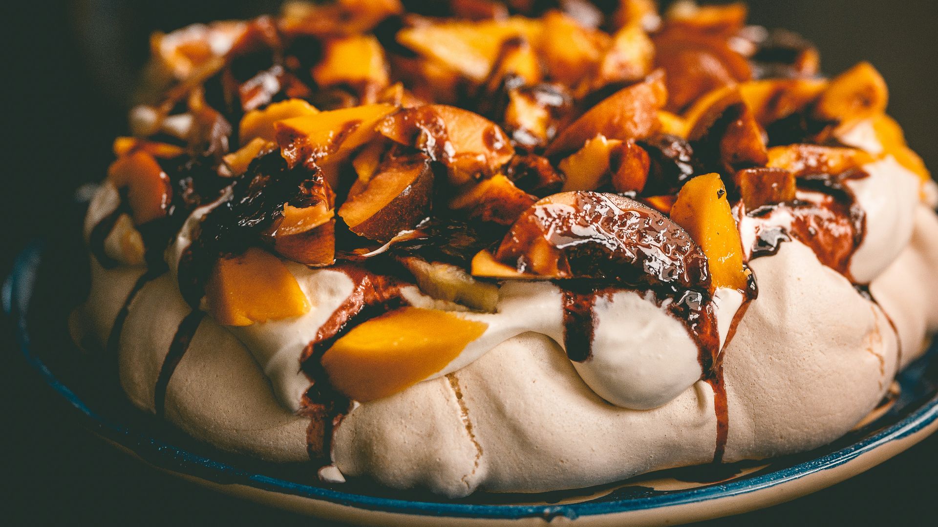 a dessert with fruit and chocolate drizzled on top