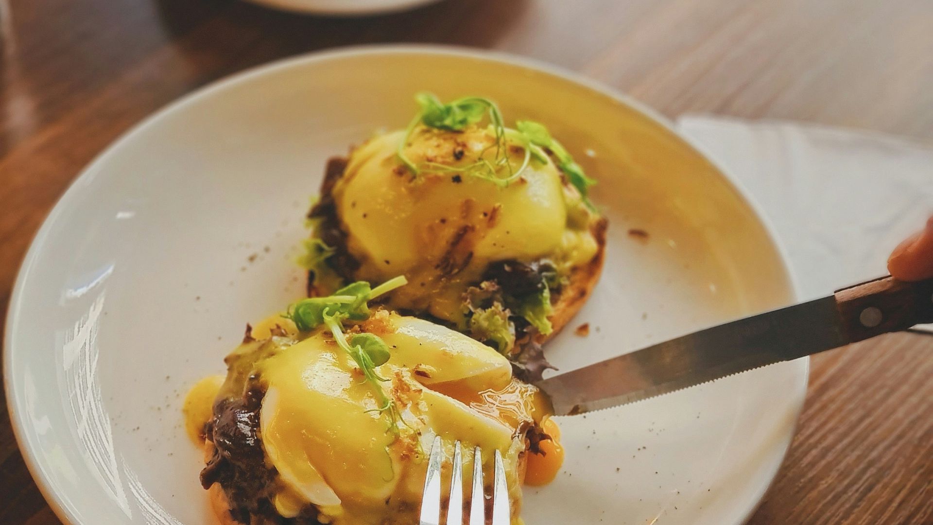 egg and bread on white ceramic plate