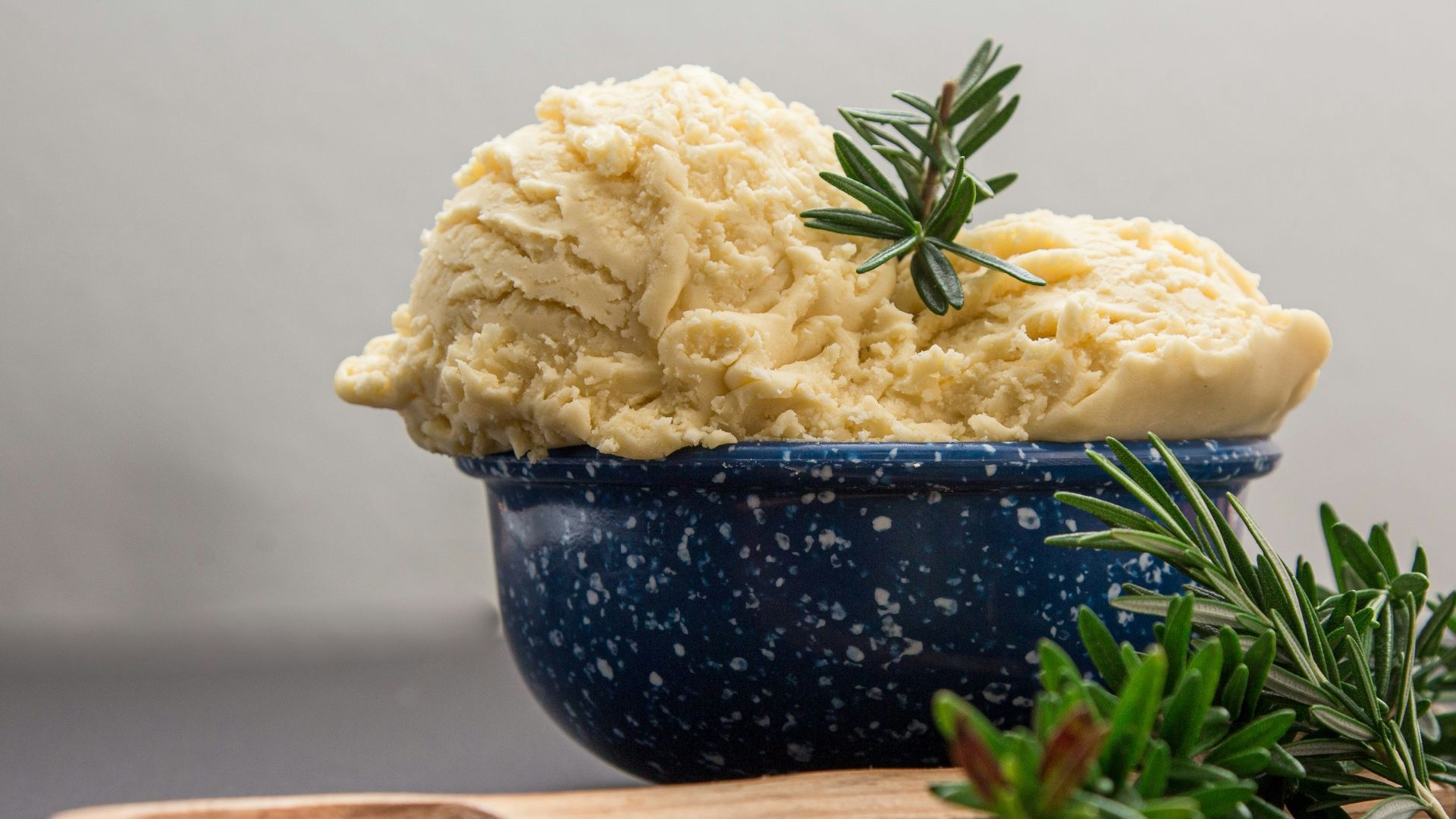 brown wooden spoon on blue ceramic bowl