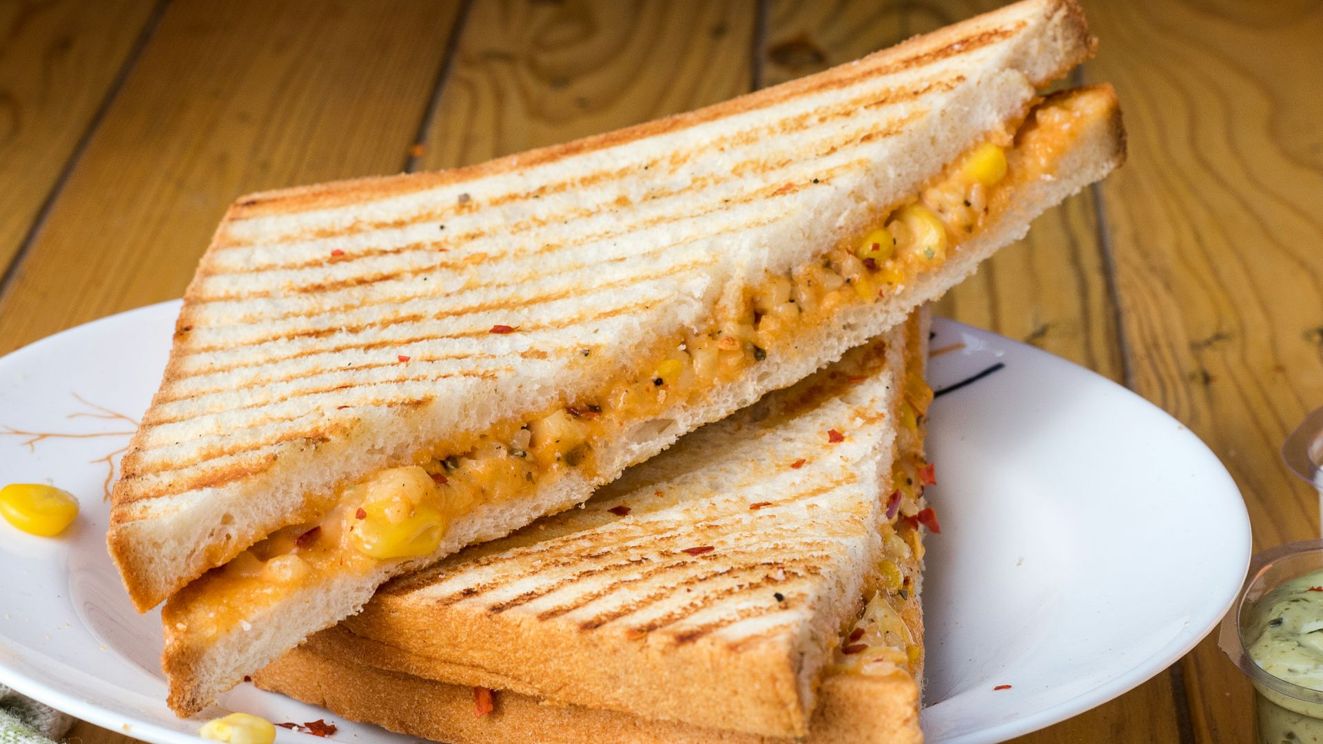 bread with cheese fillings on white ceramic plate