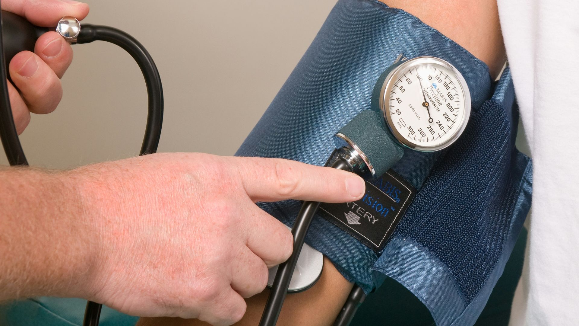 a doctor checking the blood pressure of a patient