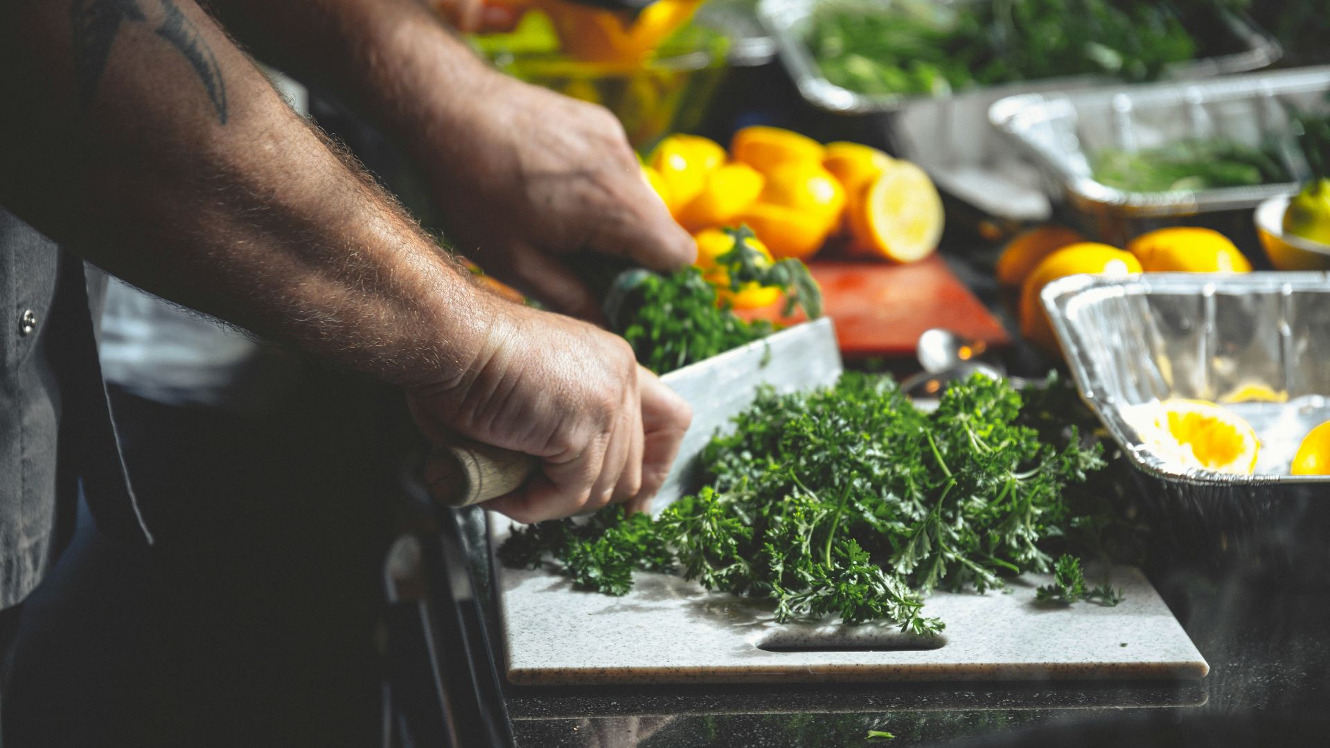 person slicing parsleys