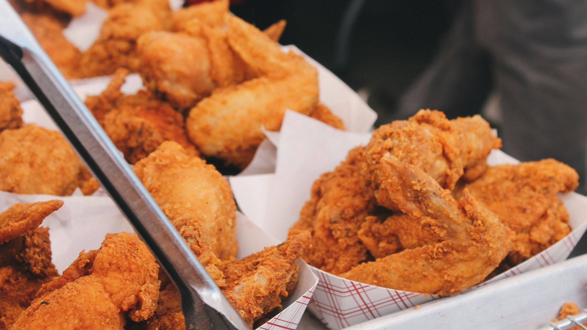 fried chicken on brown paper bag