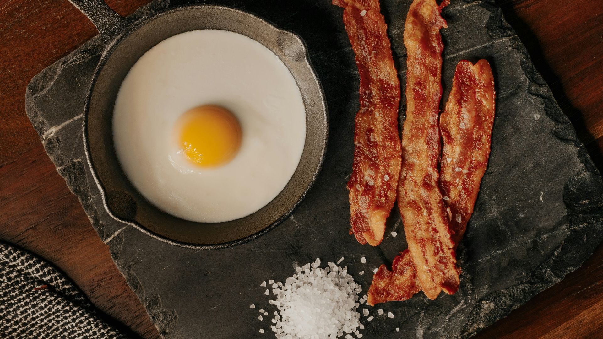 white egg on black plate