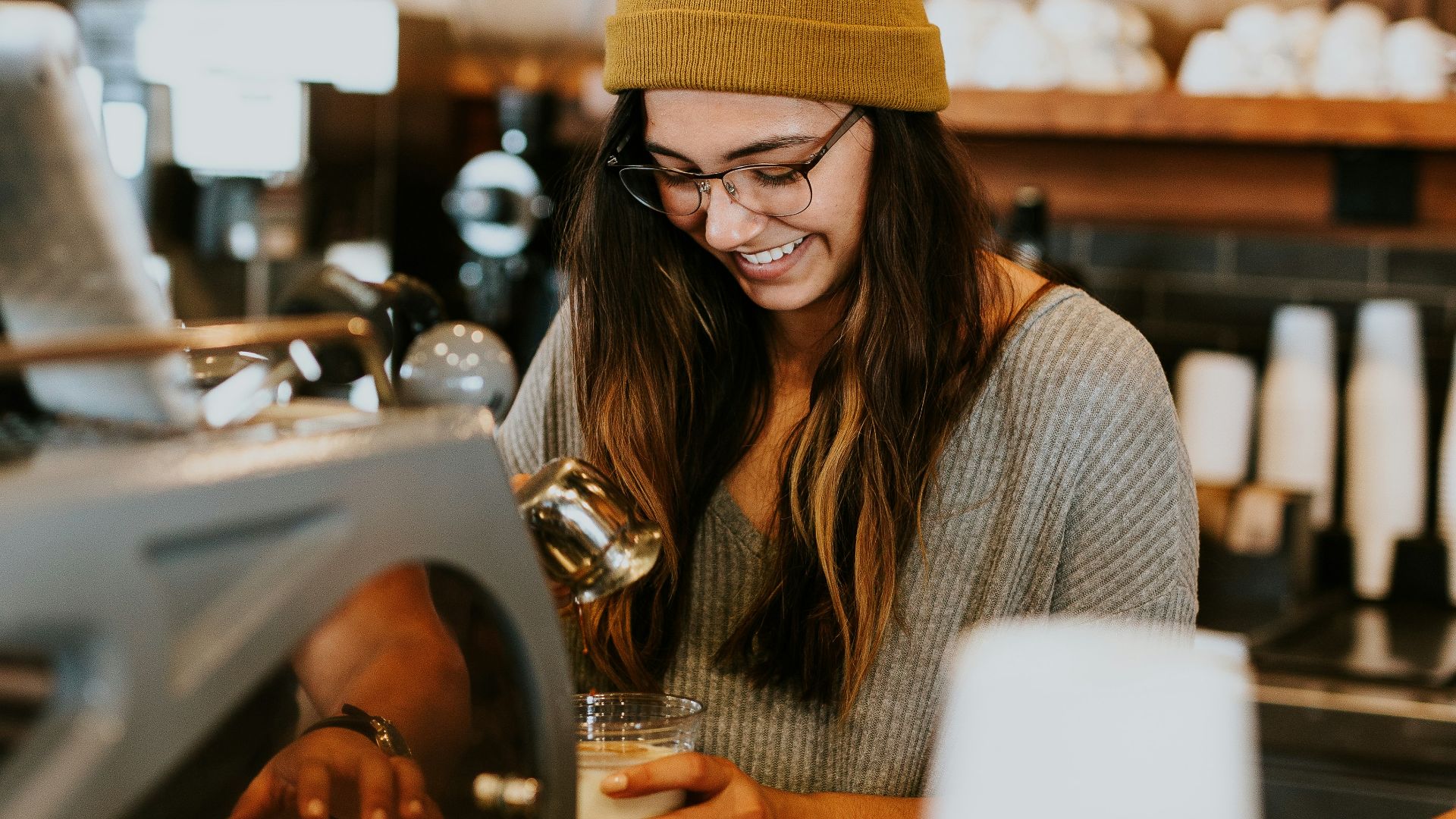 woman holding clear drinking glass