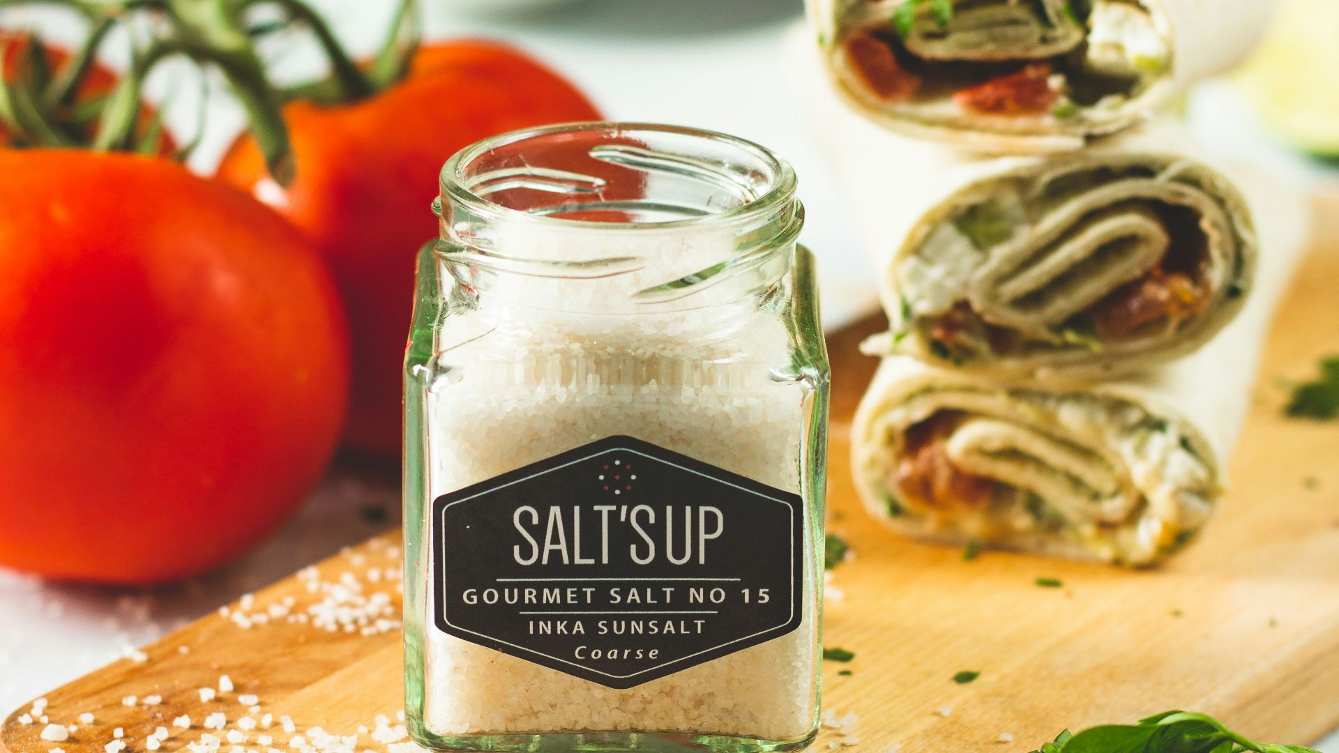 tesco garlic pepper bottle on brown wooden chopping board