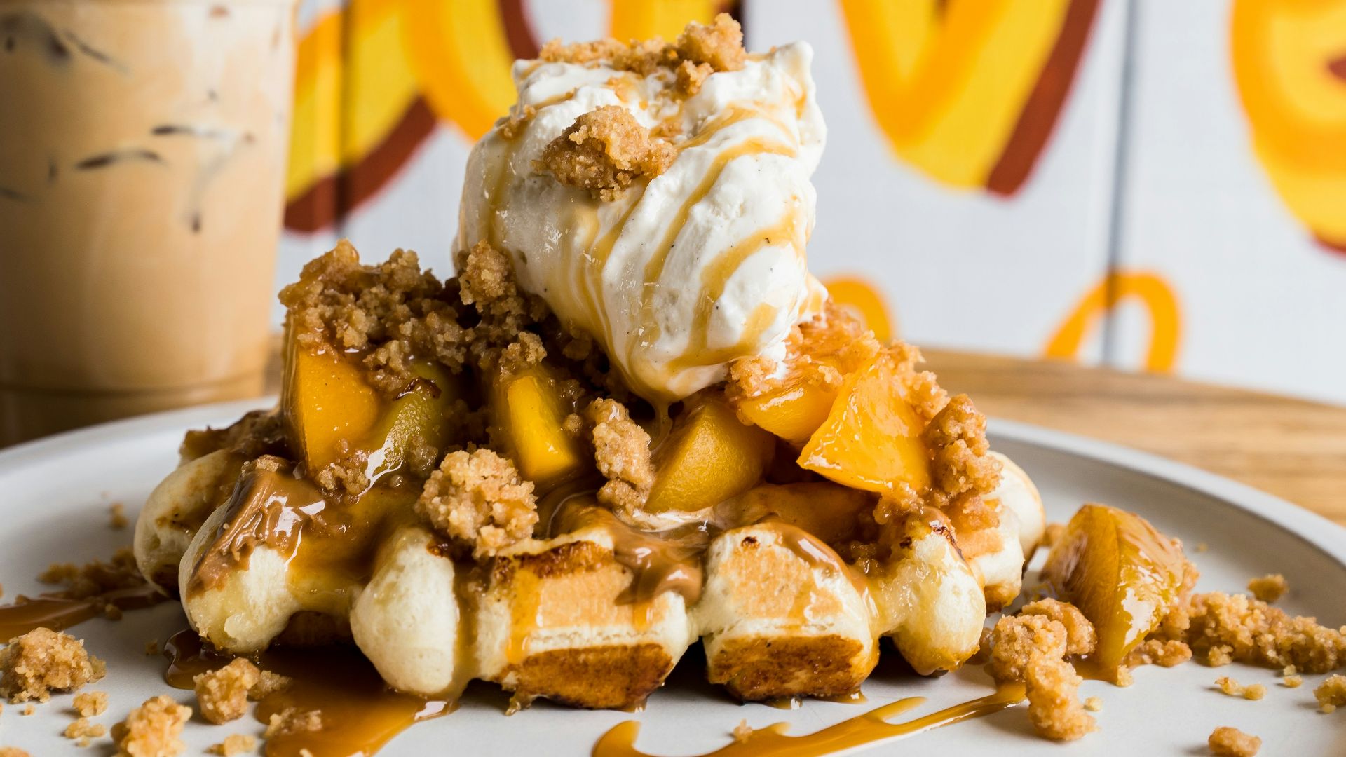 a white plate topped with waffles and ice cream